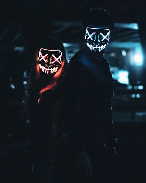 Rechargeable rave masks connected to power bank before a music festival