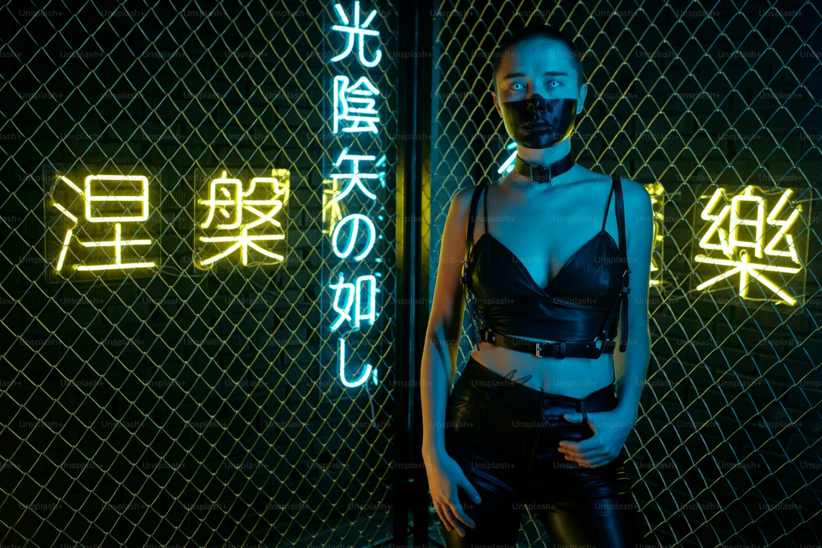 Festival outfit styled with glowing masks and rave horror accessories under neon lighting