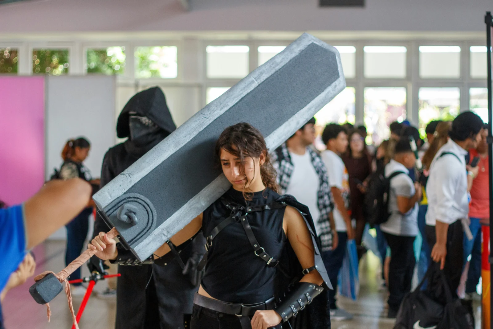 Artist adding paint details to original character props for cosplay customization